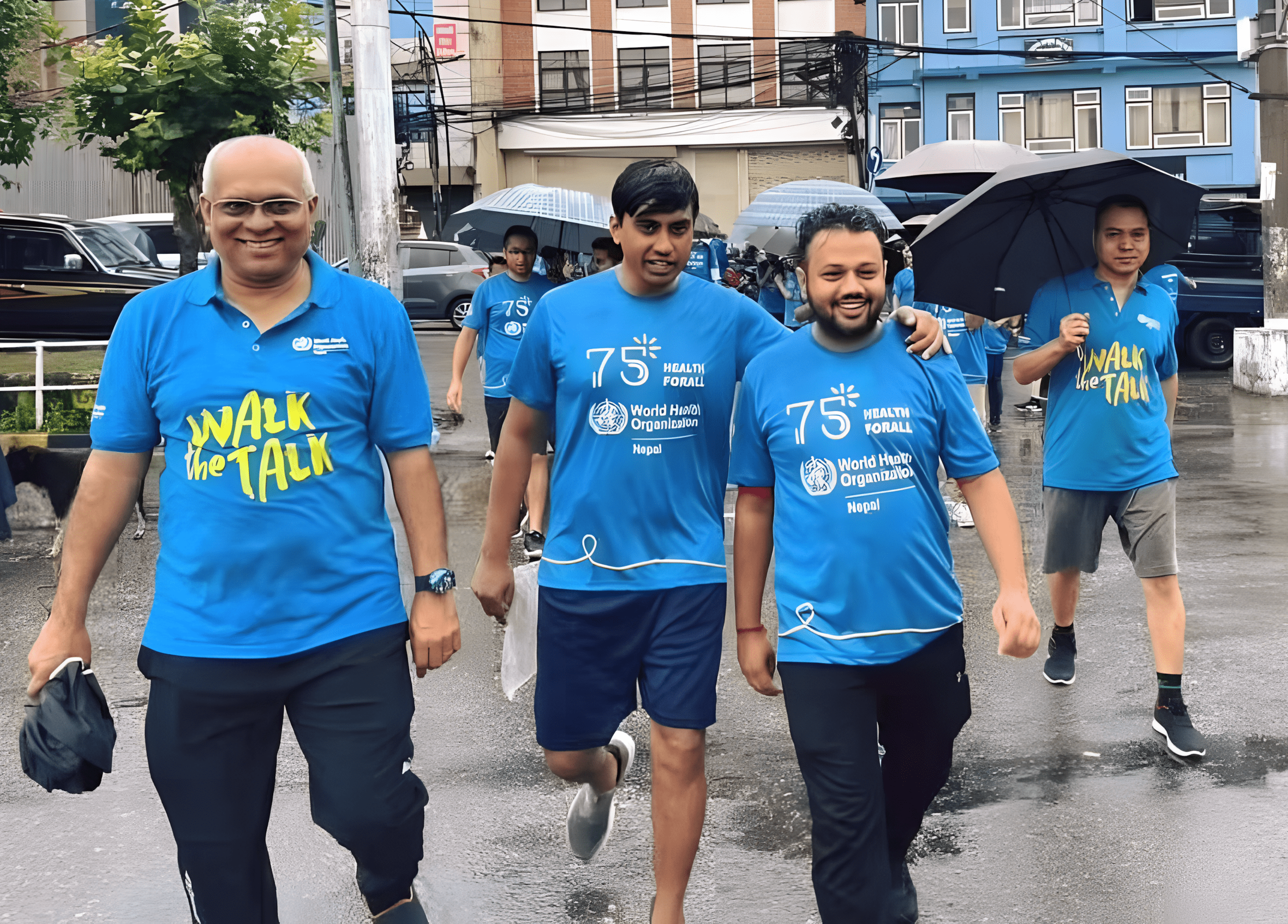Health professionals in blue shirts at Walk the Talk event